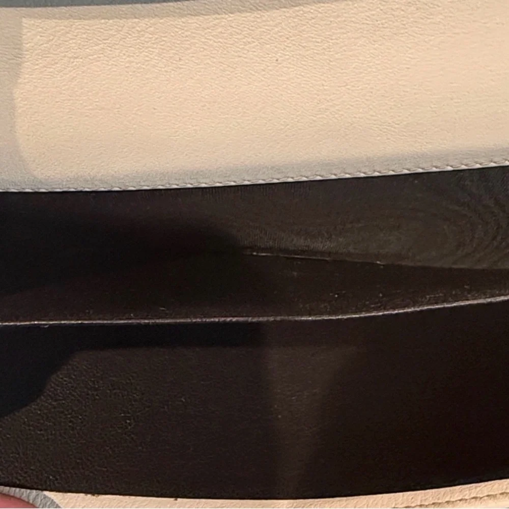 Gucci GG Canvas Long Wallet featuring white leather and heart-shaped closure